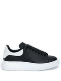 Alexander McQueen Baskets à semelle oversize noir/blanc - Lothaire boutiques